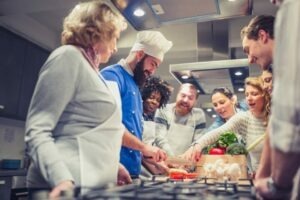Chef assisting a cooking class