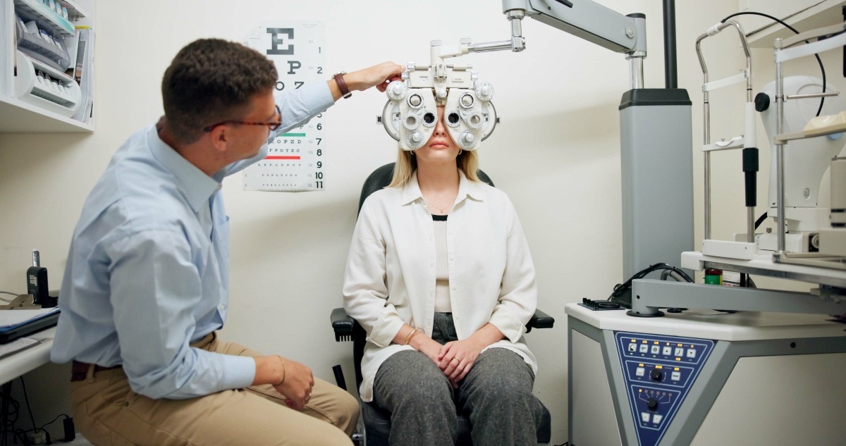 doctor-ophthalmologist-and-woman-on-phoropter-for-2024-06-11-17-20-32-utc1