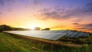 Solar panel on dramatic sunset sky background, Alternative energy concept